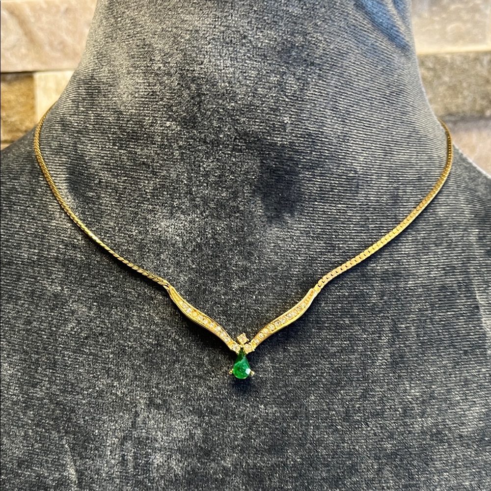 Christian Dior Gold Tone Necklace with Green Pendant 
slight discoloration